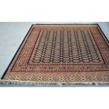 A blue ground Bokhara style carpet, 280 x 200cm.