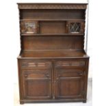A 20th century oak priory style dresser,