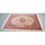 A beige ground Keshan style rug, 190 x 140cm.