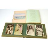 An Edwardian album containing photographs, cabinet cards,