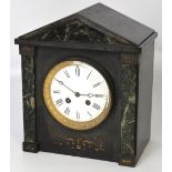 A 19th century French black slate eight day mantel clock, enamel dial set with Roman numerals,