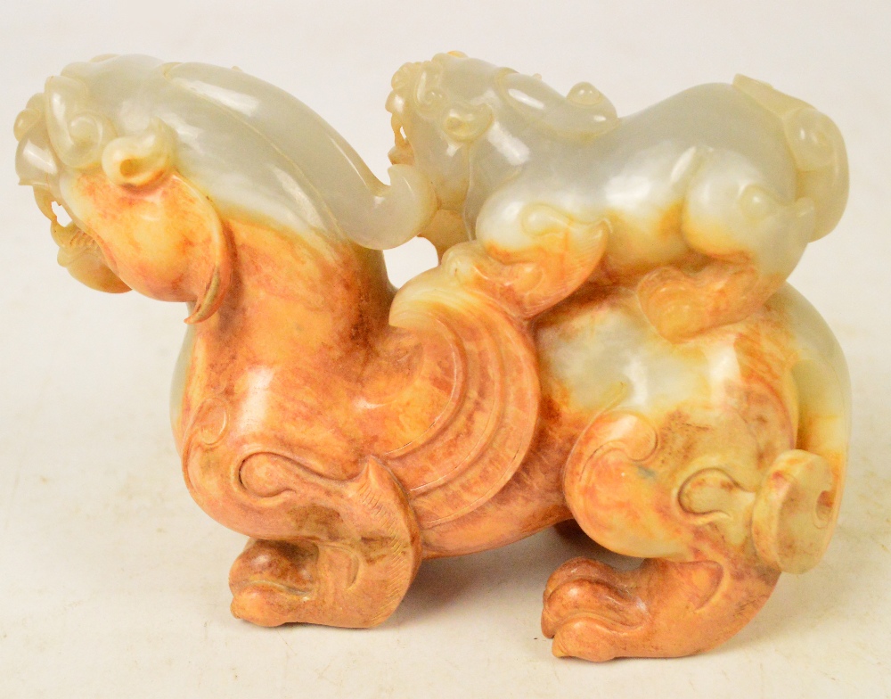 A Chinese pale celadon and russet included carved jade model of a dragon with small dragon upon the - Image 4 of 5