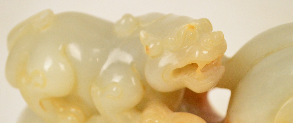 A Chinese pale celadon and russet included carved jade model of a dragon with small dragon upon the - Image 3 of 5