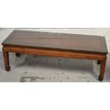 A 20th century Oriental hardwood coffee table with glass top, length 112cm.