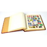 'The Liberty Postage Stamp Album' containing a quantity of 20th century British and world stamps.