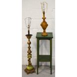 A large decorative brass and onyx table lamp with cherub support,