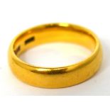 A 22ct gold lady's wedding band, size I, approx 5.7g.