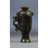 A Chinese dark jade and russet included cup and cover with pierced scrolling stylised dragon handle