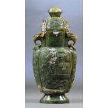 A large Chinese jade and russet included twin handled vase and cover with elephant mask drop ring