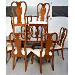 A reproduction mahogany dining table with two centre panels on twin pedestal base,