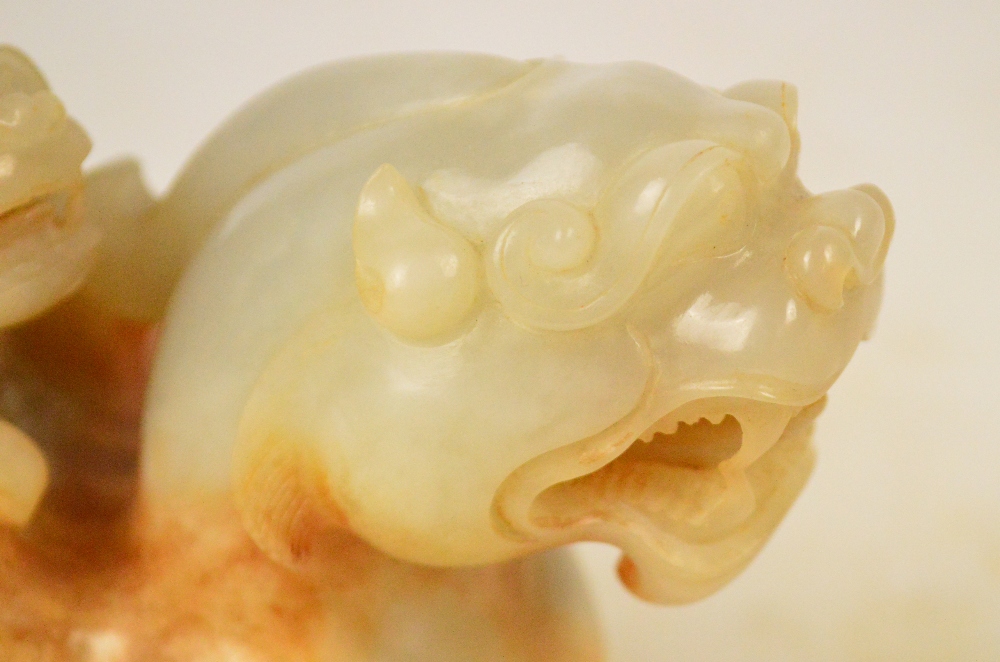 A Chinese pale celadon and russet included carved jade model of a dragon with small dragon upon the - Image 2 of 5