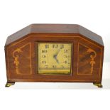 A 20th century inlaid mantel clock the brass dial set with Arabic numerals.