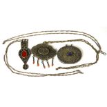 Three Afghanistan white metal pendants on white metal chains, one with lapis centre,