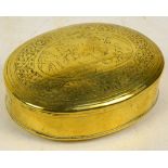 An 18th century Dutch engraved brass oval tobacco box, length 11.25cm.