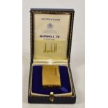 A boxed Dunhill 70 Rollagas lighter, 6 x 3cm, with instructions booklet.