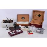 A box of twenty-five medallion Petit Coronas Havana Tobacco cigars, a wooden cigar humidor,