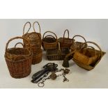 A collection of baskets, a goat bell, tap etc.