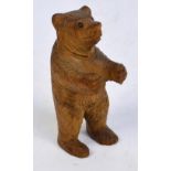 A small Black Forest carved figure of a standing bear, height 6cm.