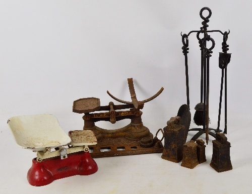 A quantity of metalware including two sets of kitchen scales, a large 7lb weight, fire tools etc.