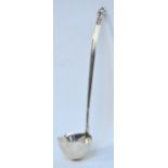 GEORG JENSEN; a silver twin lipped sauce ladle in the "Acorn" pattern also known as "Konge",