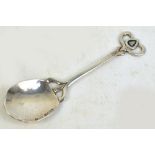 An Arts and Crafts Edwardian hallmarked silver salt spoon with part hammered shaped bowl and