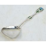 An Arts and Crafts Edwardian hallmarked silver and enamel decorated spoon,