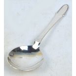 GEORG JENSEN; a hallmarked silver serving spoon in the "Beaded" pattern also known as "Kugel",