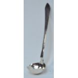 GEORG JENSEN; a small hallmarked silver double lipped cream ladle with part beaten bowl,