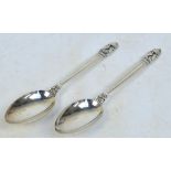 GEORG JENSEN; a pair of silver spoons in the "Acorn" pattern also known as "Konge",