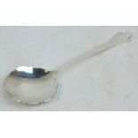 An Arts and Crafts George V hallmarked silver trefoid spoon with shaped bowl,