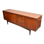 A retro G Plan style teak sideboard with three drawers,