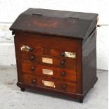 A c.1900 mahogany miniature two over three chest of drawers/cabinet, height 28cm (af).