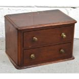 A miniature mahogany bank of two drawers formerly from a dressing table, 21 x 31cm.