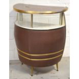 A retro 1960s semi circular cocktail cabinet with melamine top and central glass display unit,