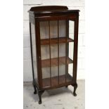 A mid 20th century oak display cabinet, one glazed door,