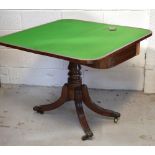 A rectangular fold over games table on central column support,