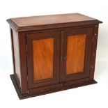 A miniature two door cabinet makers apprentice cabinet, height 30cm.