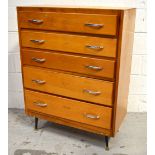 A retro five drawer chest of drawers with chromed handles on tapering supports, width 76cm.