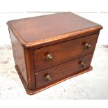 A miniature mahogany bank of two drawers formerly from a dressing table, 21 x 31cm.