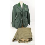 A WWII German green felt uniform jacket and a pair of similar trousers (2).