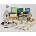 A quantity of electroplated items to include various cased flatware, part condiment sets,