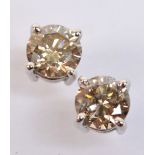 A pair of 18ct white gold diamond ear studs,