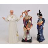 Three Royal Doulton figures; HN2877 "The Wizard", HN2016 "The Jester" (boxed),