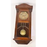 A 1930s mahogany wall clock with applied pilaster detail either side astragal glazing,