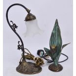 A decorative metal table lamp with floral base, curved stem and opaque glass shade, height 41cm,