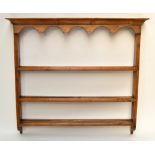 A plate rack with frieze top above three shelves, 108 x 120cm, depth 14.5cm.