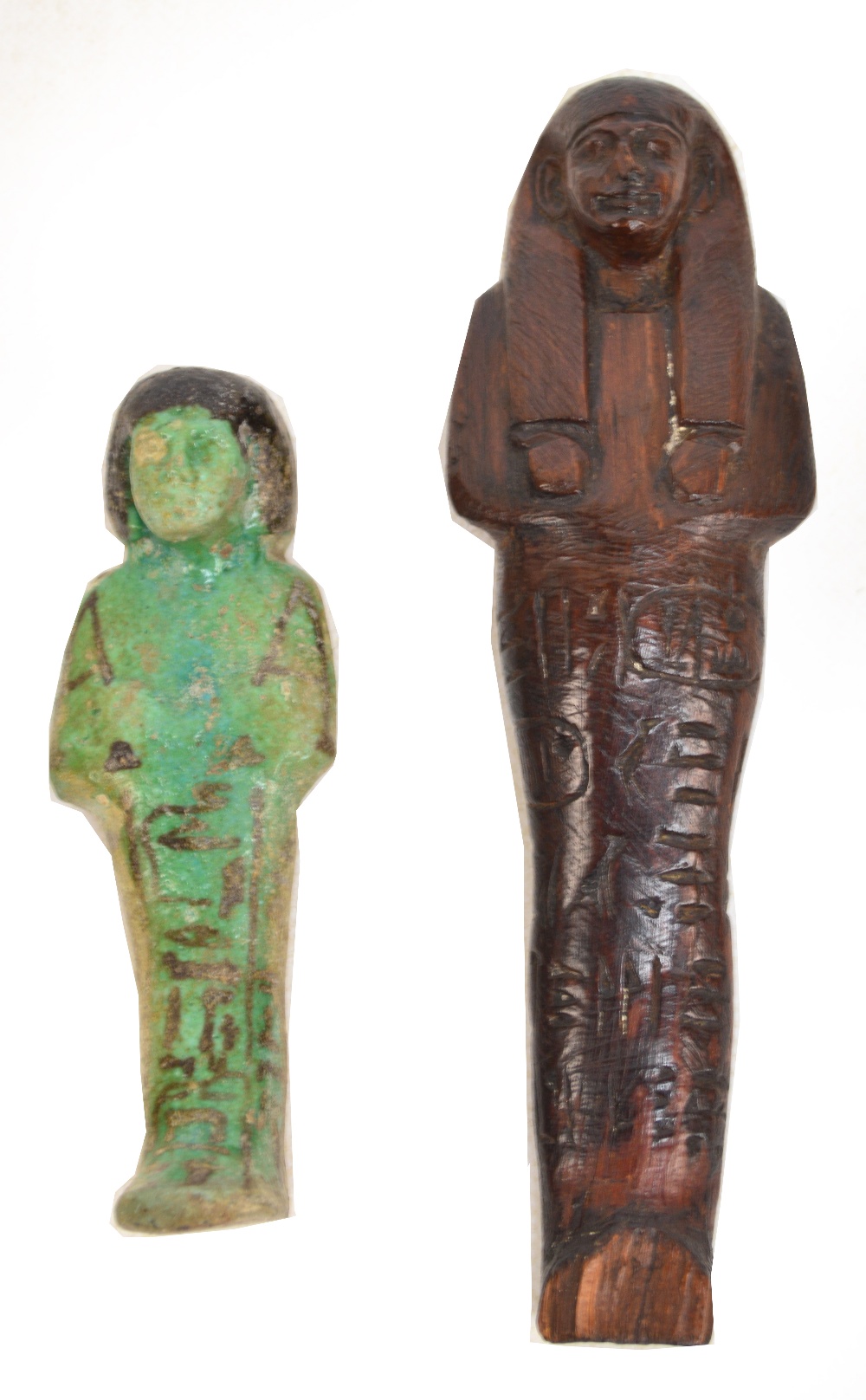 An ancient Egyptian pottery Ushabti with turquoise glaze, length 12.