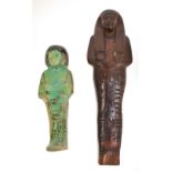 An ancient Egyptian pottery Ushabti with turquoise glaze, length 12.