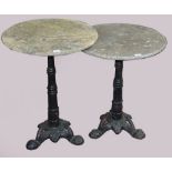Two cast iron occasional tables with bamboo shaped supports and tripod feet,