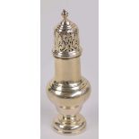 A George V hallmarked silver sugar caster of baluster form with pierced domed cover and turned